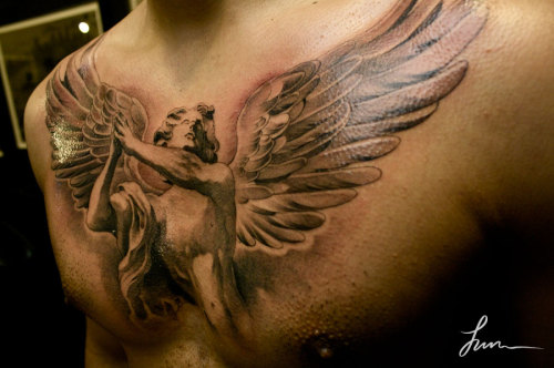 Religious chest piece tattoos