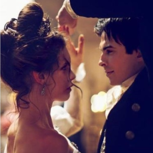 This doesn&amp;amp;#8217;t look like a 20&amp;amp;#8217;s decade dance. Looks almost midevil.Elena&amp;amp;#8217;s in puffy sleeves and a tiara. Damon&amp;amp;#8217;s wearing a frilly white shirt and coat with big brass buttons. That&amp;amp;#8217;s way older than just the 20&amp;amp;#8217;s.