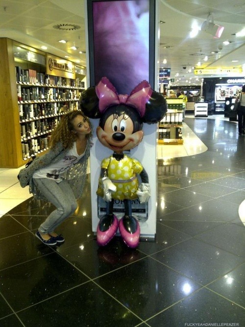 beautifulcurlyhairedweirdo :Danielle at the airport with Minnie Mouse!