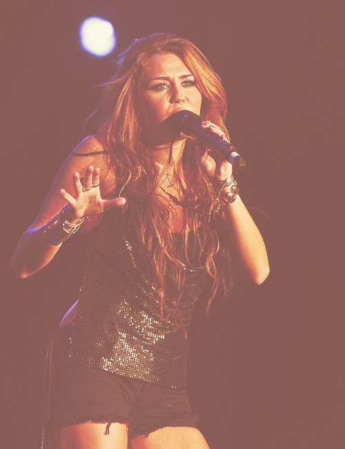  27/30 pictures of Miley singing 